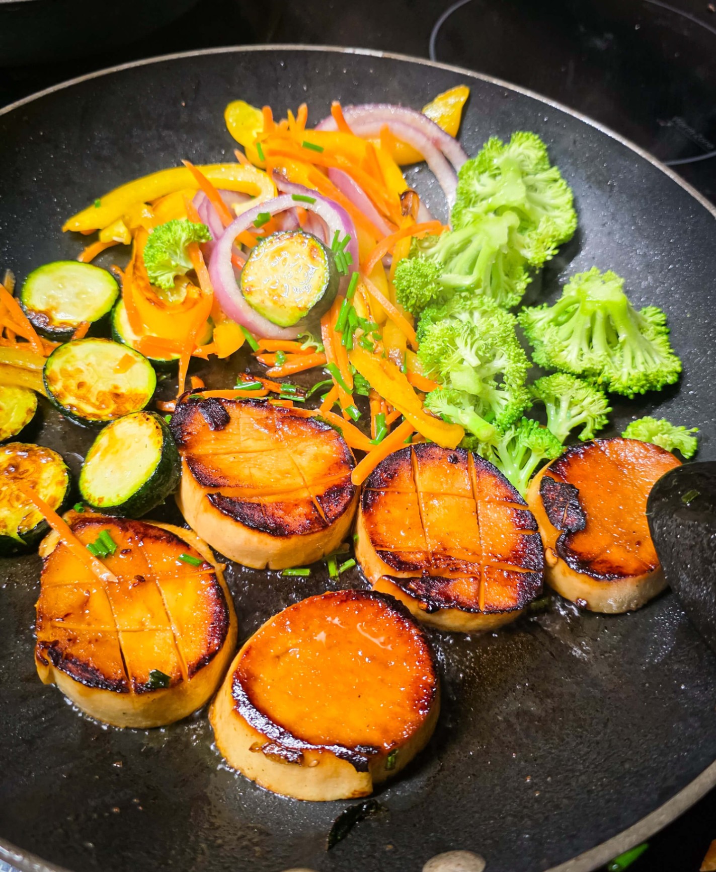 Pan-seared sweet potato medallions with sautéed vegetables