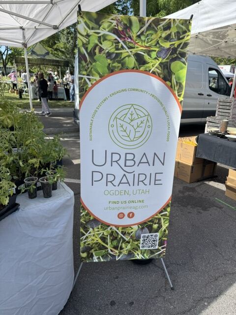 Urban Prairie Agriculture banner at the Ogden Farmers Market